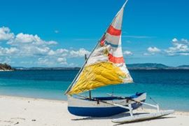 Sail boat on beach in Madagascar