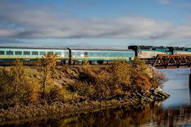 Train crossing bridge in Autumn