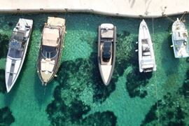 Overhead drone view of boats docked at Ornos