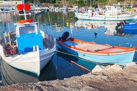 Wooden fishing boats moored in port of Tsilivi
