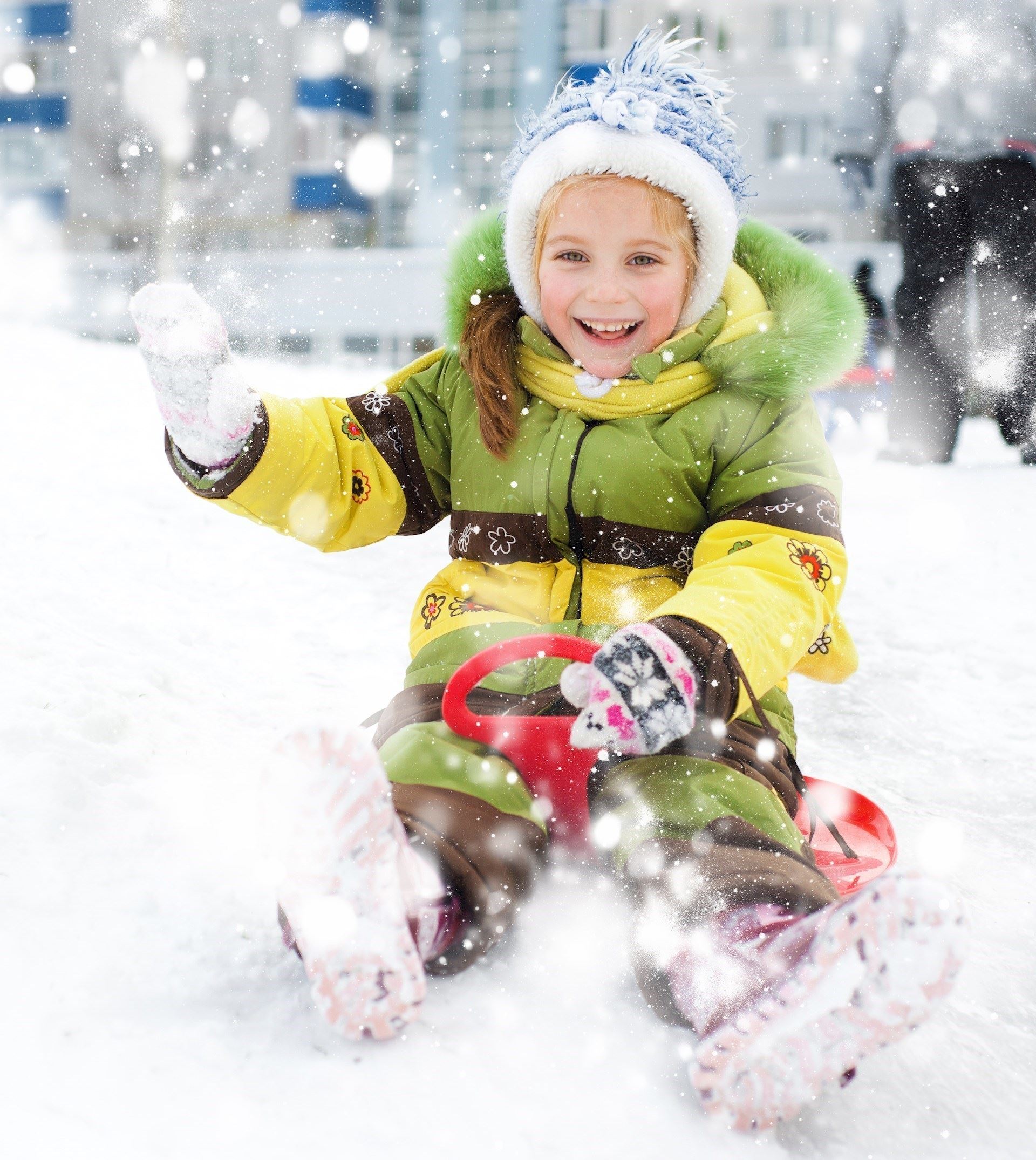 Europe Holidays -Finland, Lapland - Happy child on sledge in winter