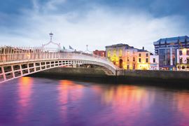 Europe Holidays - UK & Ireland - Dublin - dusk with waterfront and historic Ha'penny Bridge